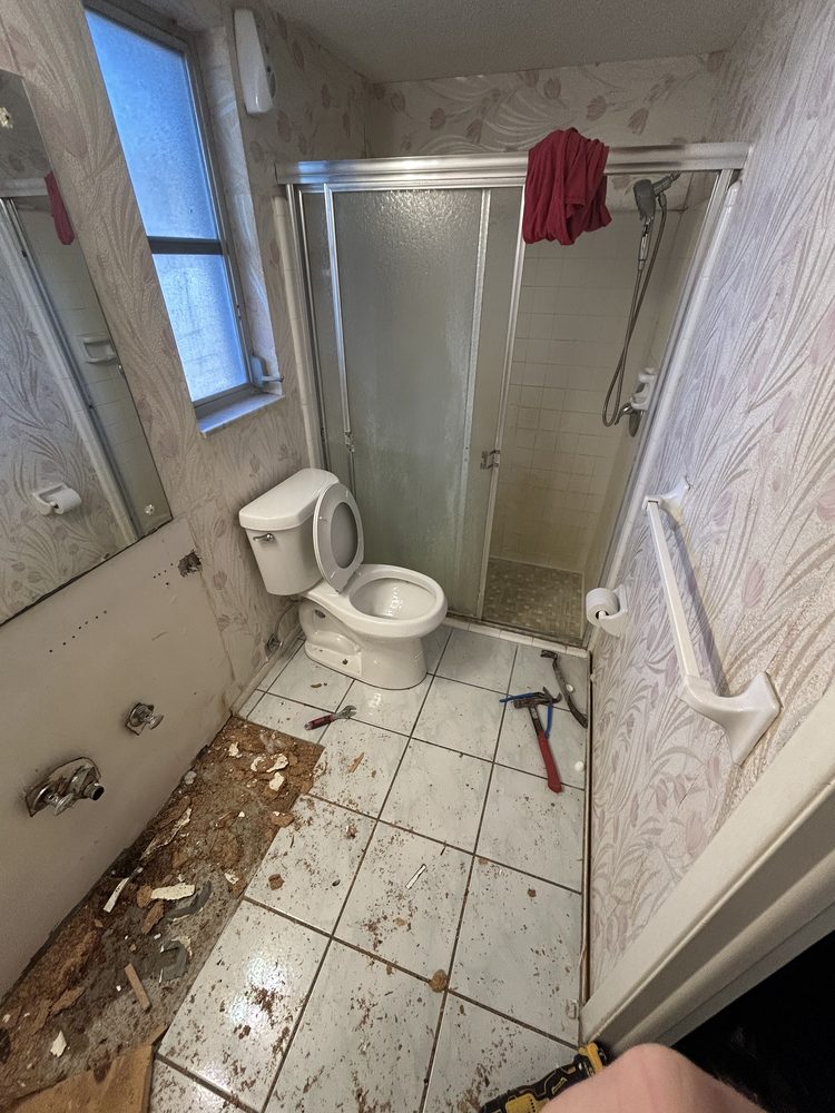 Bathroom stripped to the studs during a full gut remodel in Pinellas County