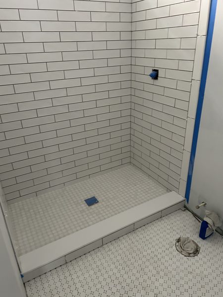 Subway tile shower surround finished in a St. Petersburg bathroom remodel