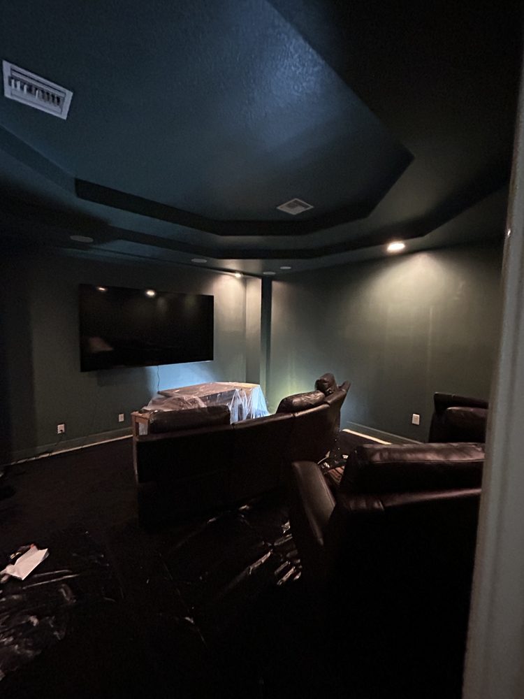 Media room after repainting and trim work in a Pinellas County home