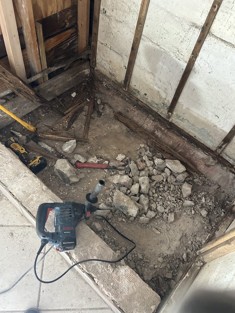 Concrete slab prepared for a new shower drain in a Pinellas County bathroom