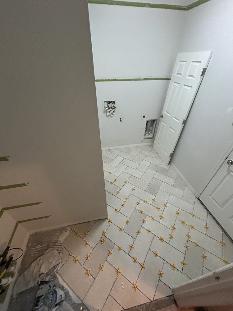 Herringbone floor tile finished in a Pinellas County laundry room