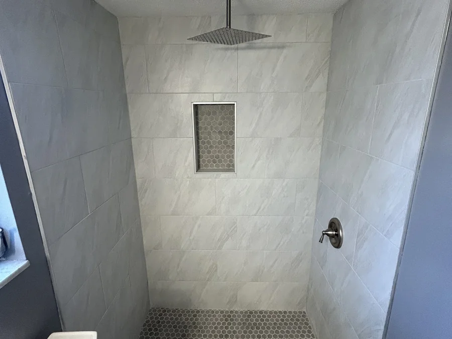 Tiled walk-in shower in a remodeled Pinellas County bathroom